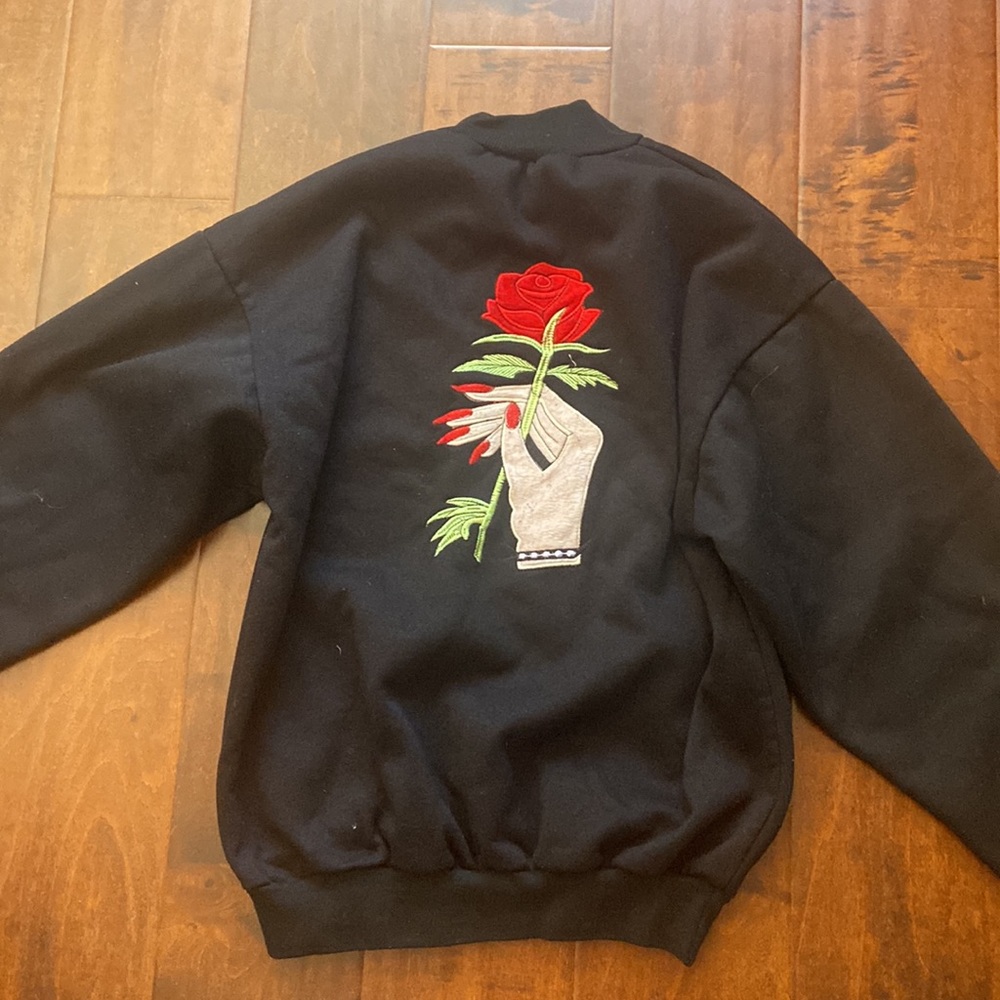 hand holding rose embroidered sweatshirt - Picture 2 of 2